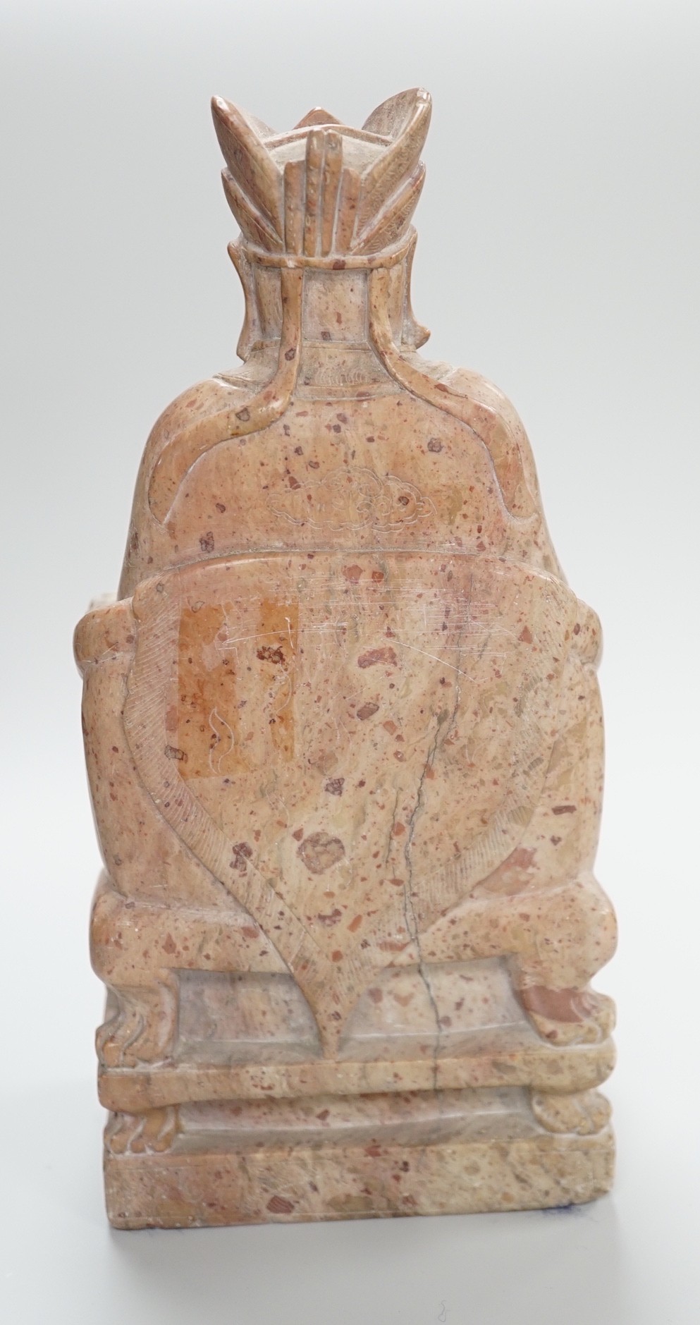 A Chinese soapstone seated figure of an Emperor, 19cm tall